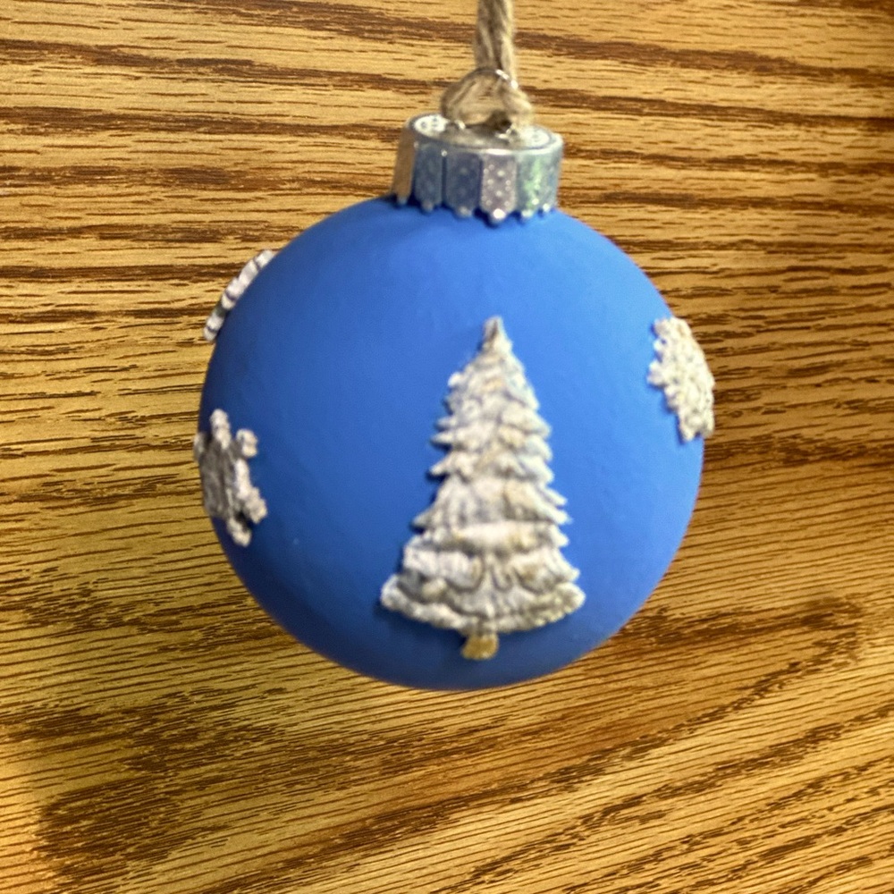 Blue Ornament with Christmas Tree and Snowflakes in white silver and gold.